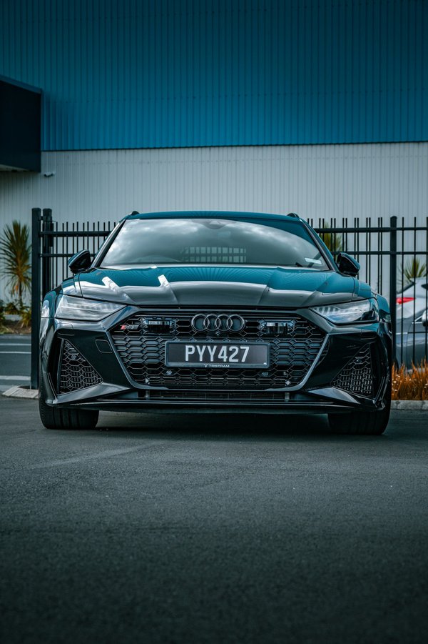 How can you enhance the bi-xenon headlights on a British luxury sedan for improved night visibility?